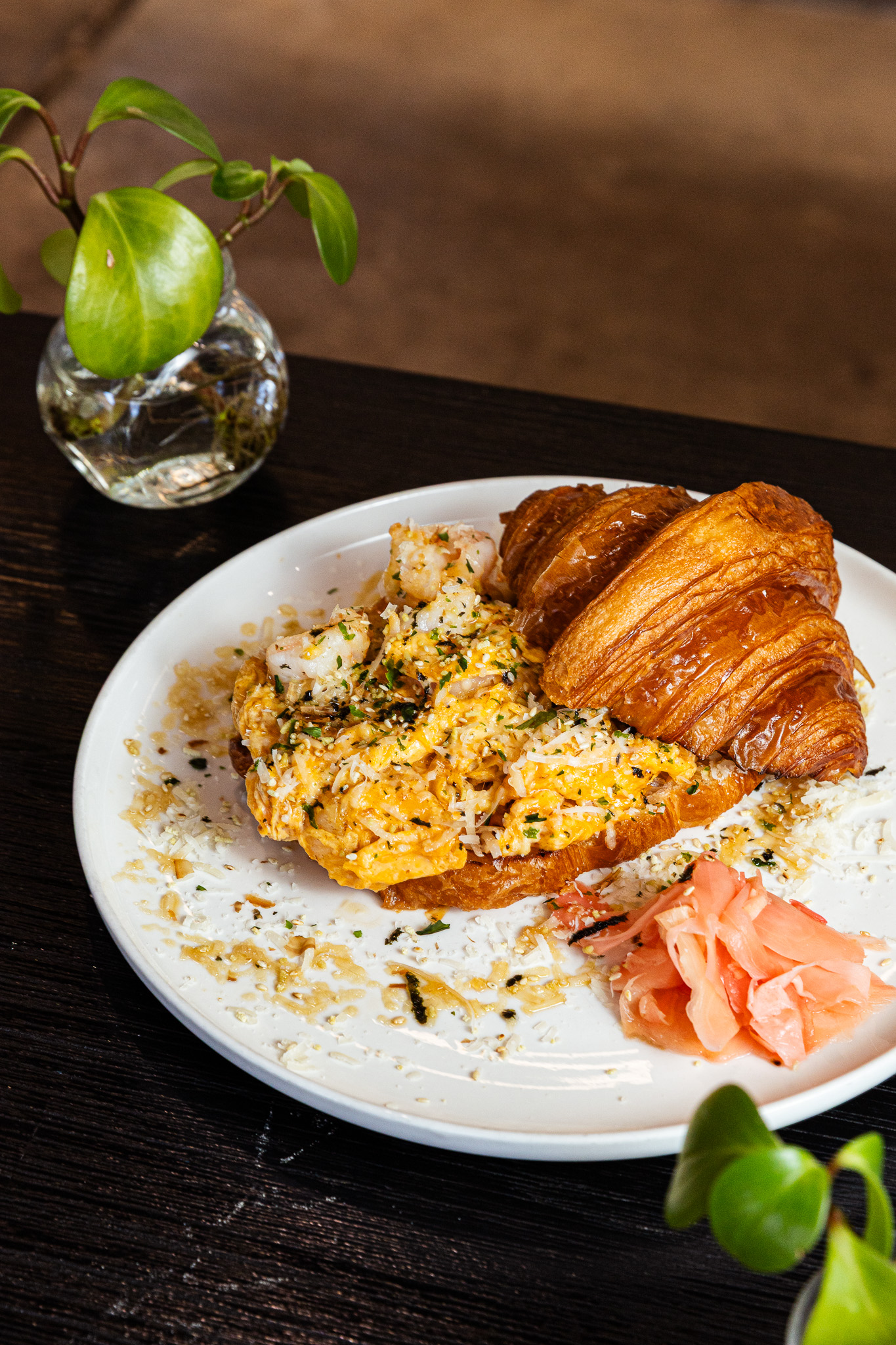 Prawn scrambled egg on croissant